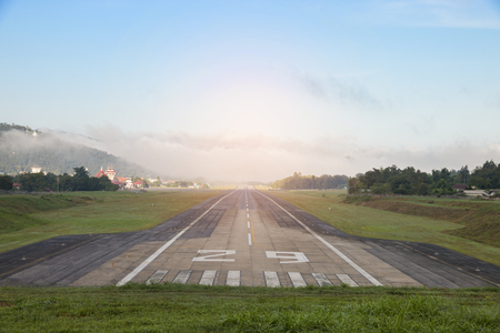 Airport runway with mountain in countrysideの写真素材