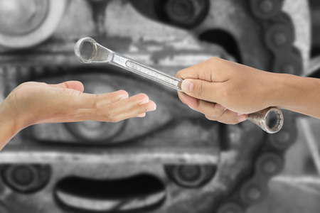 hand give a wrench isolated on white background - clipping pathsの写真素材