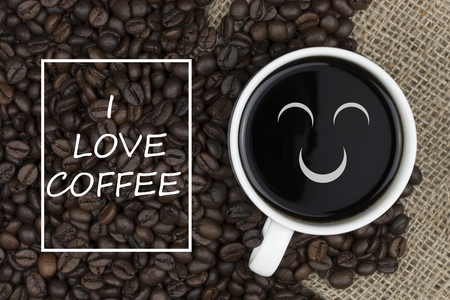 i love coffee text in coffee cup on coffee beans backgroundの写真素材