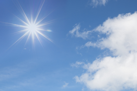 Shining sun at clear blue sky with free text spaceの写真素材