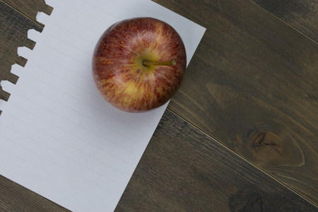 Apple fresh with white paper on wooden tableの写真素材