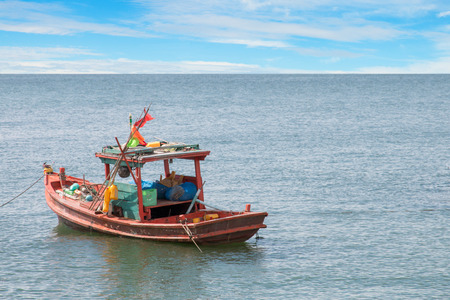 old wooden fishing boat in the sea.