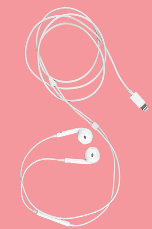 earphones on pink background.の写真素材