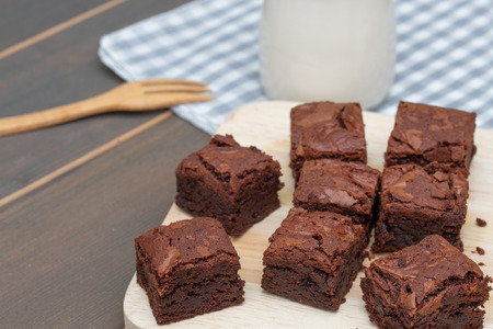 homemade cake chocolate brownies and milk on wooden tableの写真素材