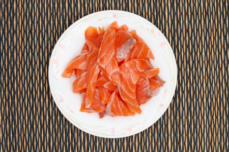 sliced raw salmon in dishの写真素材