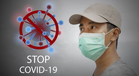 Stop Coronavirus with young male wearing protective face mask.の写真素材