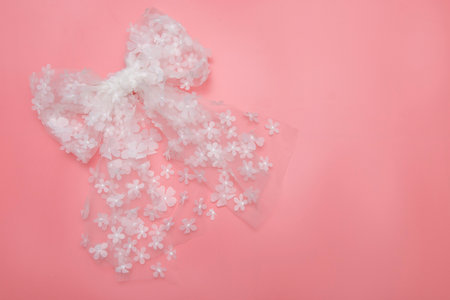 Beautiful hair bow for girls. Fashion accessory for girls hair on pink background.の写真素材