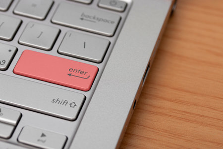 Close-up of a red enter button on the keyboard.の写真素材