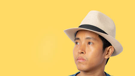 Portrait of man with straw hat isolated on yellow background. clipping paths.の写真素材