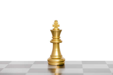 The king chess pieces, golden king chess on a chessboard. isolated on white background.の写真素材