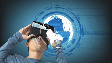 Young man using virtual reality headset. VR, future technology online concept. Digital Screen.
