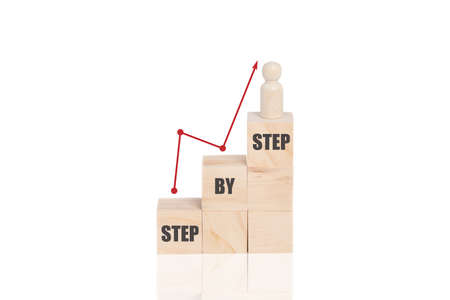 Wooden block stacking as step stair on top with word Step By Step with arrow up. Business growth...