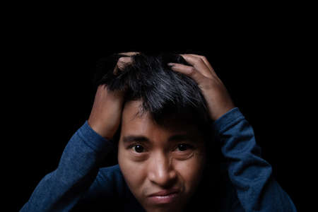 Portrait of asian man worried about problems something. Problem and crisis concept.の写真素材