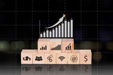 Wooden block with icon business strategy and analyze forex trading graph financial data. Technology online concept.の写真素材
