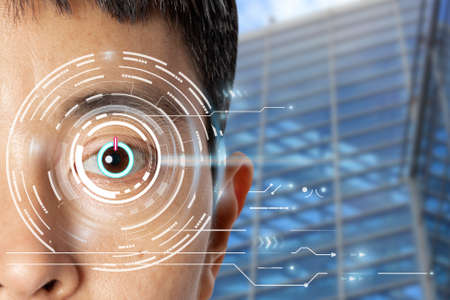 Close up of eye in process of scanning with power button icon technology digital information.