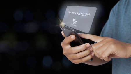 Man holding smartphone with online shopping payment successful. e-commerce business online. shopping...