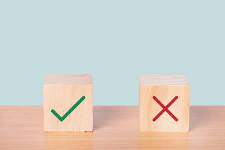 True and false symbols accepted rejected, Yes or No on wood cubes.の写真素材