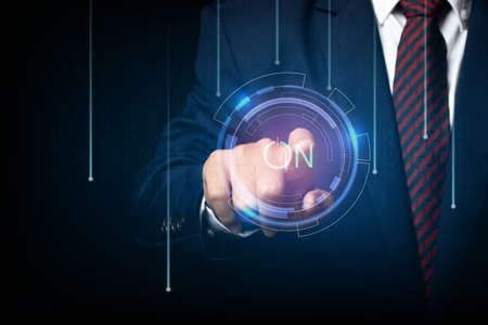 businessman touching screen, pushing on a touch screen power button. concept innovation.の写真素材