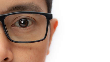 Portrait of a young man with eyeglasses isolated on white background. copy space.の写真素材