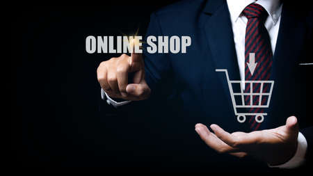 Businessman touching online shop button. e-commerce business online concept. shopping online concept.の写真素材
