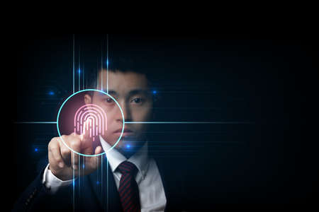 Businessman scan fingerprint biometric identity and approval. business technology safety concept.の写真素材