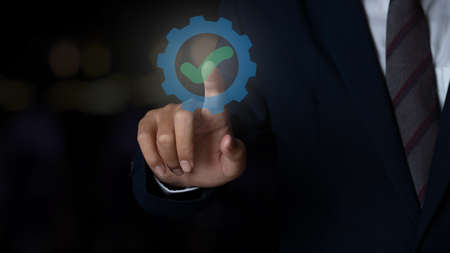 Businessman shows sign top service Quality assurance, ISO certification, Assurance and standardization concept.の写真素材