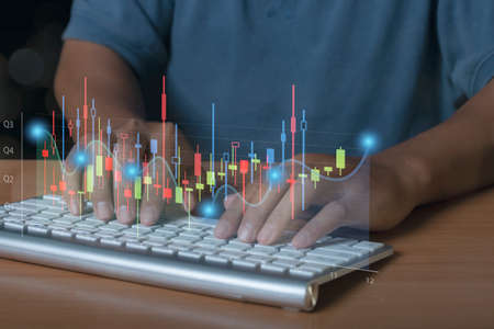 Businessman stock trading analyzing graph chart forex by using computer. Business graph finance...