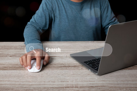 Man working with computer laptop searching browsing internet data information networking for vacancies or position. recruiting, finding jobs. Concept of job search find your career.の写真素材