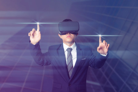 Businessman wearing VR virtual reality Headset virtual Global Internet connection metaverse. Glasses of virtual reality and exploring the metaverse. Technology, gaming, entertainment concept.の写真素材