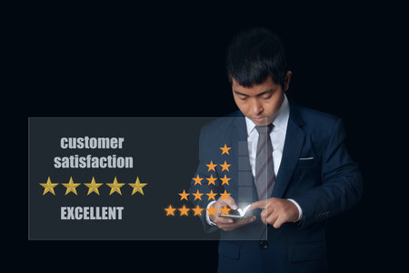 Businessman use smartphone choosing screen on five star icon to give satisfaction in service rating...
