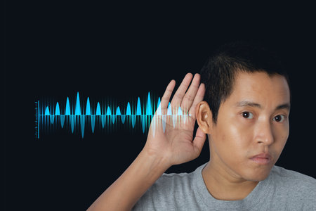 Young man hand over ear listening an hearing to rumor or gossip with sound waves. Audio sound...