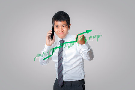 Businessman using smartphone trader forex stock, Stock Market Investments analysis and Digital Assets. Business finance technology and investment concept. feeling winner gesture and victory happy.の写真素材