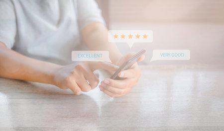 Customer satisfaction experience concept. Businessman giving high score with five golden stars rating satisfaction in service. rating very impressed. excellent, very good. copy space.の写真素材