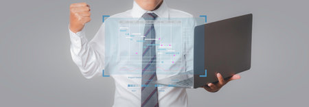 Project timeline management. Businessman design plan schedule on virtual screen with laptop...