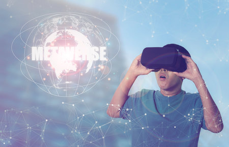 Business network communication and technology on workplace exploring the metaverse. Man wearing VR...