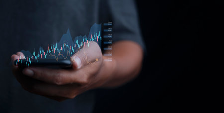 Stock Market Investments analysis and Digital Assets. Business finance technology and investment concept. Stock market graph with man touching stock trading screen background.の写真素材