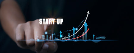 Startup business and network connection. Businessman accessing startup business touching virtual screen with icon startup network connection on modern virtual interface.の写真素材