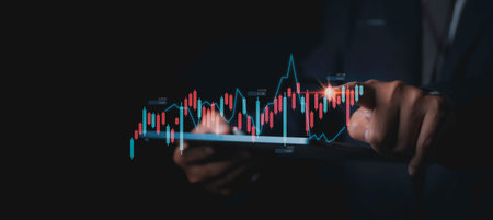 Stock Market Investments analysis and Digital Assets. Business finance technology and investment concept. Stock market graph with man touching stock trading screen background.の写真素材