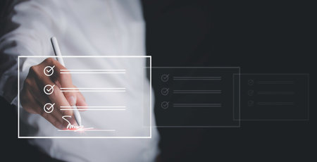 Electronic signature and paperless office concept. Businessman uses a pen sign electronic documents...