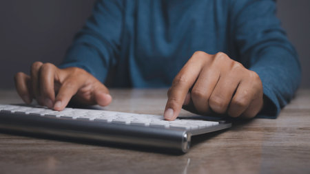 Businessman typing on computer keyboard. Man hand working at office table of keyboard computer....