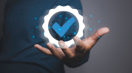 Man holding quality assurance icon or QA and Quality Control or QC. Quality management certification and standardization proces, ISO certified business, conformity to international standards.の写真素材