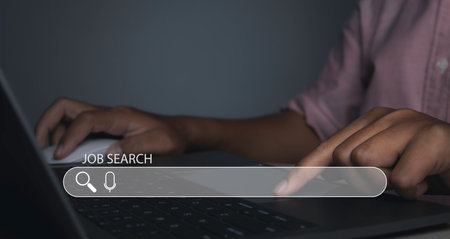 Job search, Searching browsing internet data information networking. Man browsing work opportunities online by laptop computer. Search Engine Optimization SEO Networking. copy spaceの写真素材