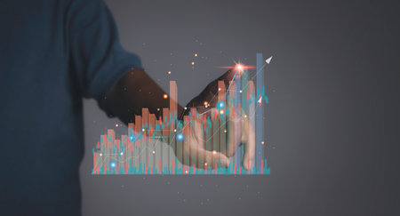 Stock Market Investments analysis and Digital Assets. Business finance technology and investment concept. Stock market graph with man working on laptop stock trading computer screen background.の写真素材