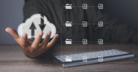 Document Management System (DMS), Businessman access business connection online documentation database and process automation to efficiently manage files. Cloud computing technology.の写真素材