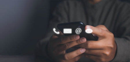 Contact us or Customer support hotline people connect. Businessman access contact connect online by smartphone with virtual screen contact icons. Customer service call center concept. copy space.の写真素材