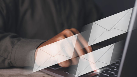 Businessman using laptop computer typing send email. Business contact and communication with email...