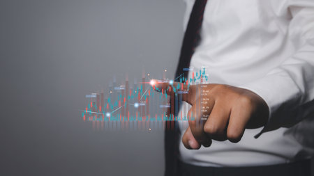 Stock Market Investments analysis and Digital Assets. Business finance technology and investment concept. Stock market graph with man touching stock trading screen background.の写真素材