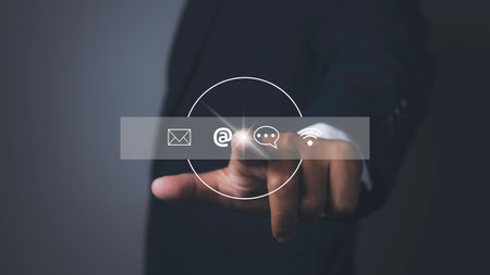 Contact us or Customer support hotline people connect. Man touching contact access connect online with virtual screen contact icons. Customer service call center concept. copy space.の写真素材
