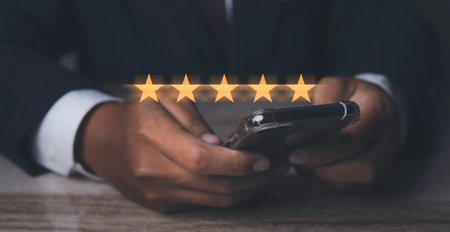 Customer satisfaction experience concept. Businessman giving high score with five golden stars rating satisfaction in service. rating very impressed. copy space.の写真素材