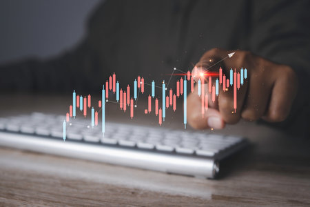 Stock Market Investments analysis and Digital Assets. Business finance technology and investment concept. Stock market graph with man touching stock trading screen background.の写真素材